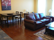 Living room with hardwood flooring and leather furniture in a furnished short term apartment in peterborough from Cader Lofts