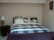 Beautifully furnished Bedroom with a Sleigh Bed in Cader Lofts Furnished Apartment for rent in Peterborough